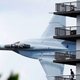 Illustration for article titled FA-18 Is Flying Too Damn Terrifyingly Close to That Building